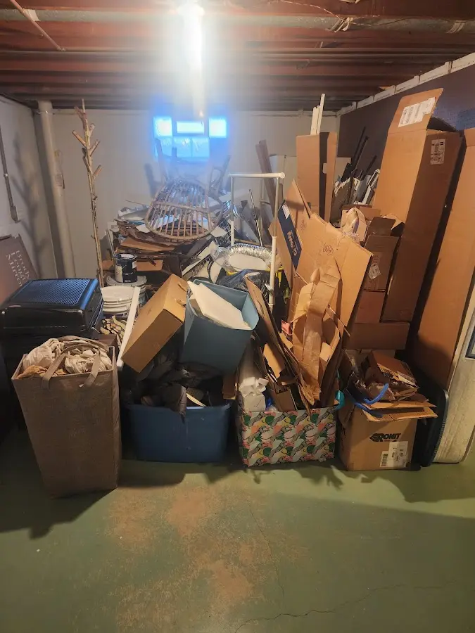 Roll-off dumpster container at job site for 15 Yard Dumpster Rental in Farr West